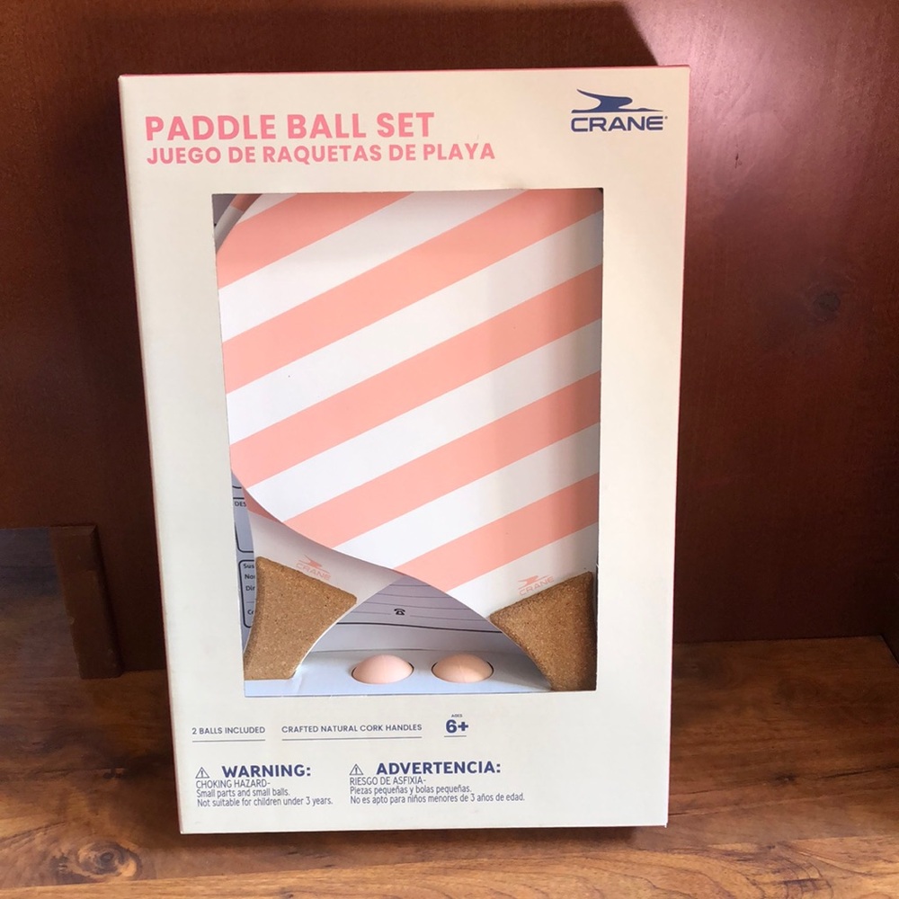 Crane Paddle Ball Set with pink and white striped design. 2 balls & 2 paddles
